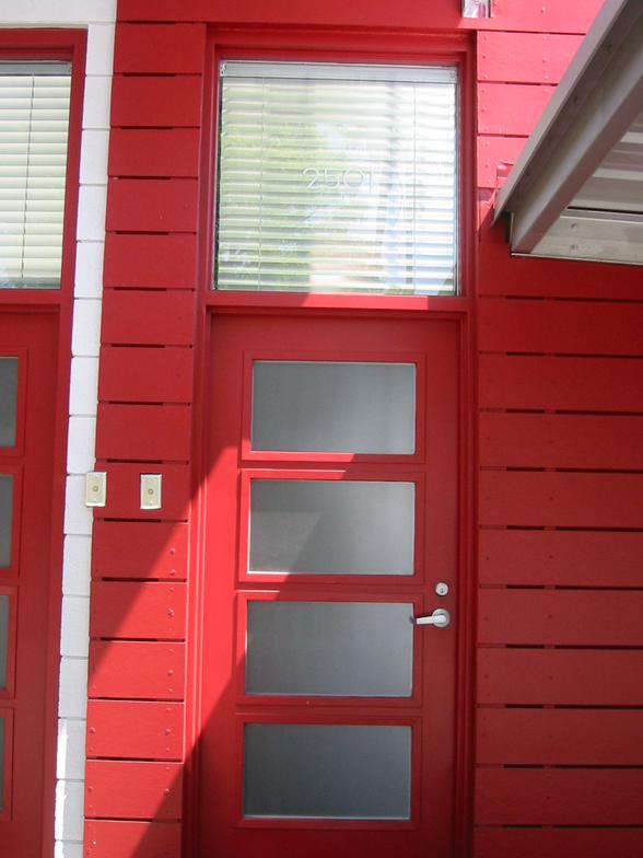 Red steel door with sidelight and transom