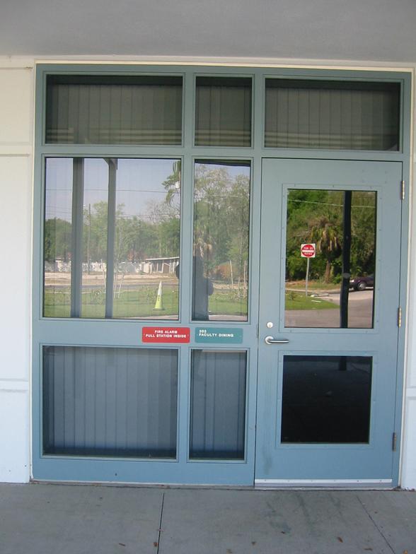Blue hollow metal storefront entrance