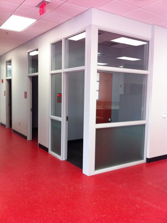 Glazed interior partitions with red flooring